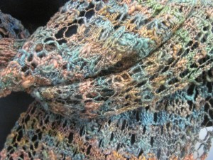 Detail of the textured yarn knitted into the lace stitch pattern