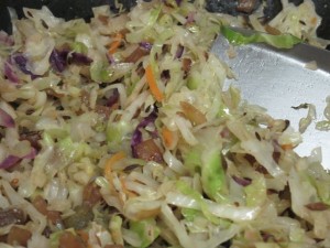 A view of the cabbage in the wok. 