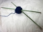 Little blue ball of yarn and aluminum needles