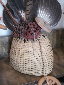 A garlic basket I handmade is displayed with some of my other special spindles